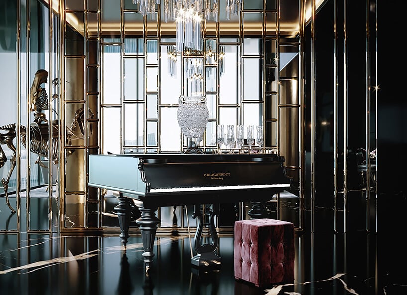 luksusowe wnętrze apartamentu w Dubaju od Covet Houseczarno złote wnętrze pokoju z czarnym fortepianem i czerwoną pufą