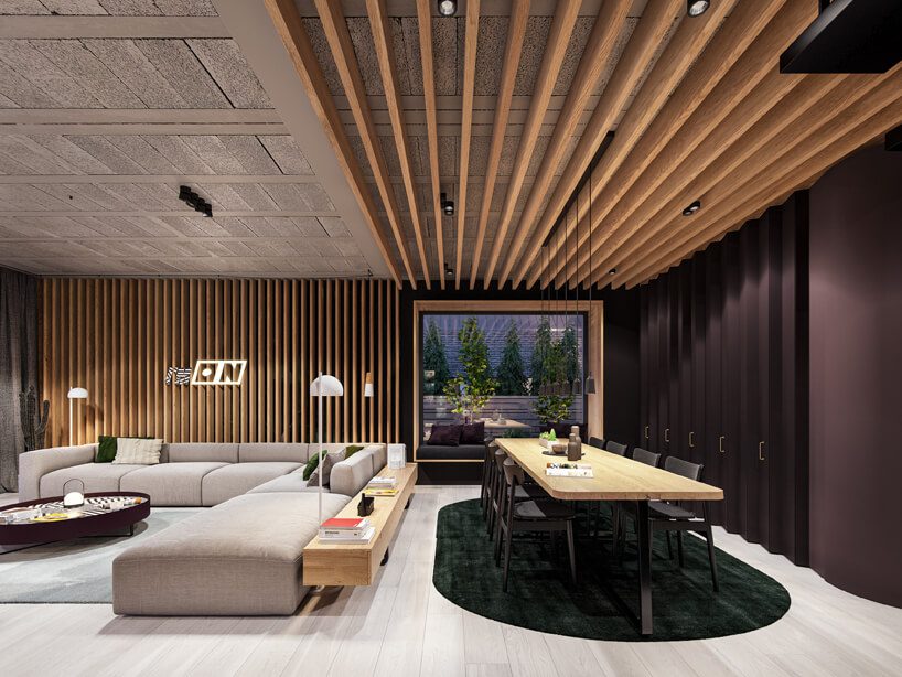 projekt nowoczesnego wnętrza domu od Zarysy jadalnia z jasną podłogą dużym stołem z drewnianym blatem obok szarej modułowej sofy