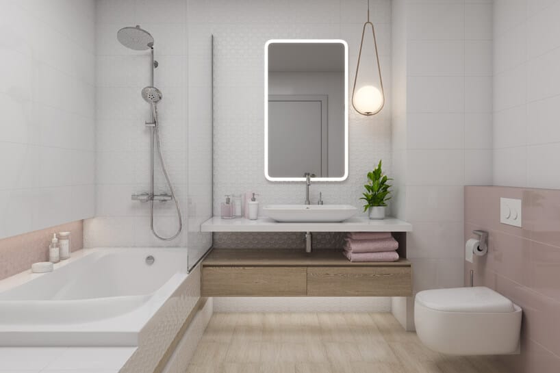 jasna łazienka z różowymi akcentami i kwadratowym lustrem i dużą wanną
